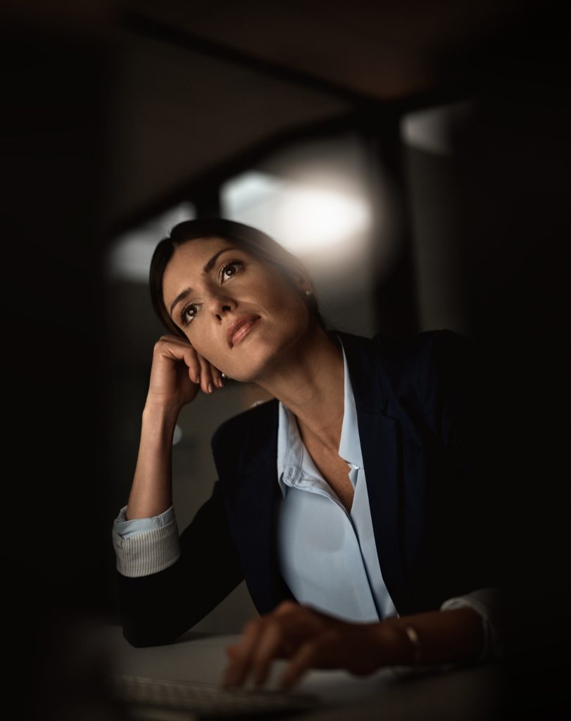pondering businesswoman scaled